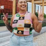 Portrait of nonbinary autistic person outdoors with a stim toy