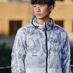 man in white and black zip up jacket